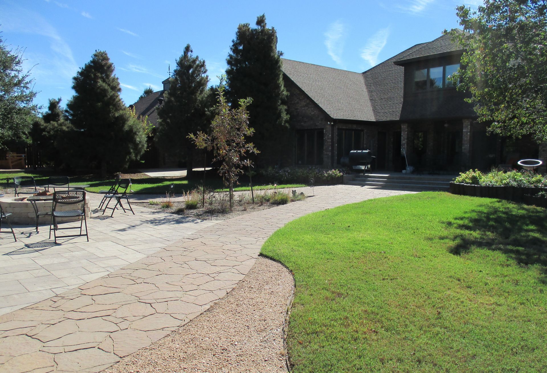 A large house with a lush green lawn in front of it