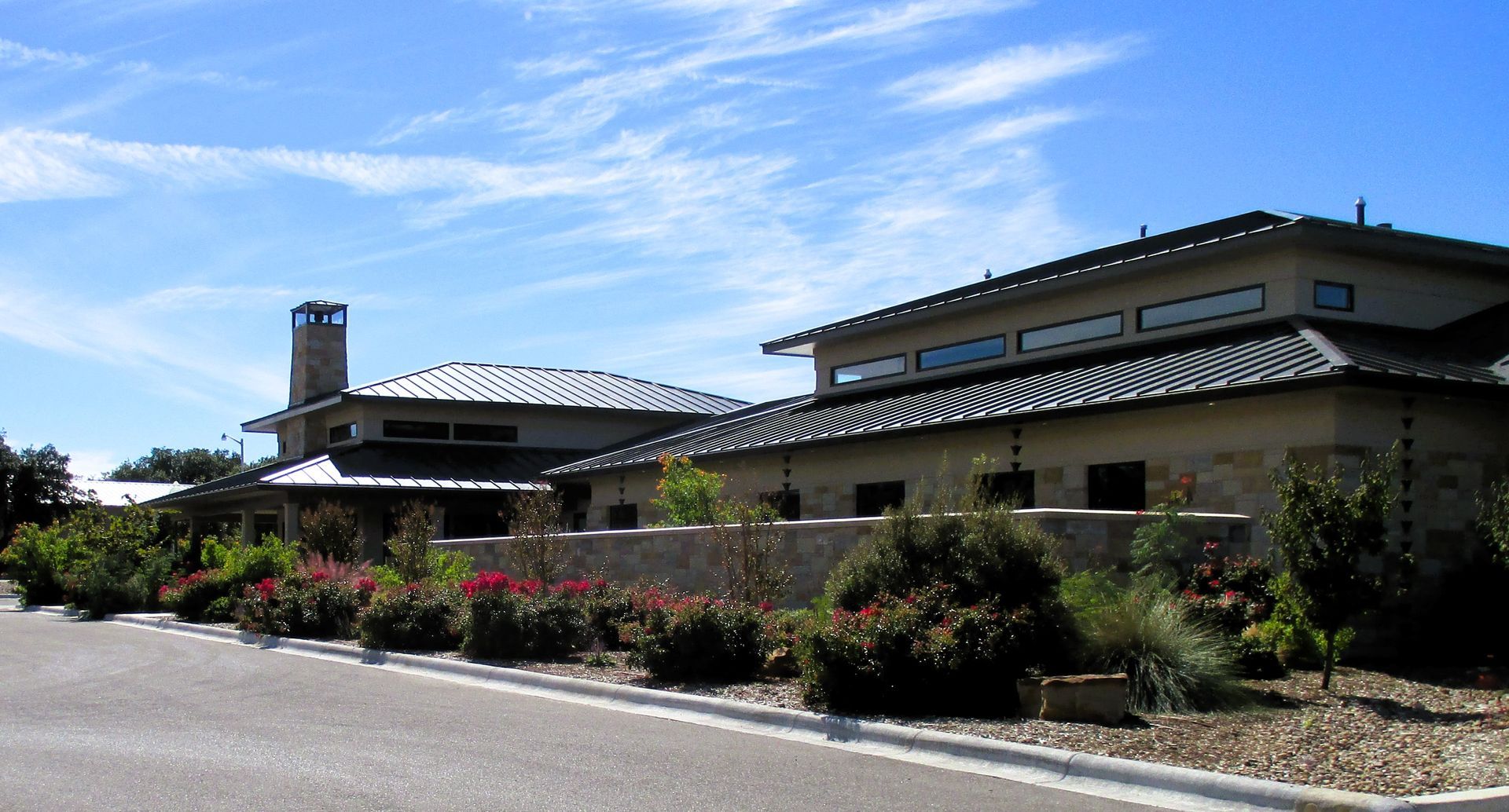 A large house with a chimney on the top of it
