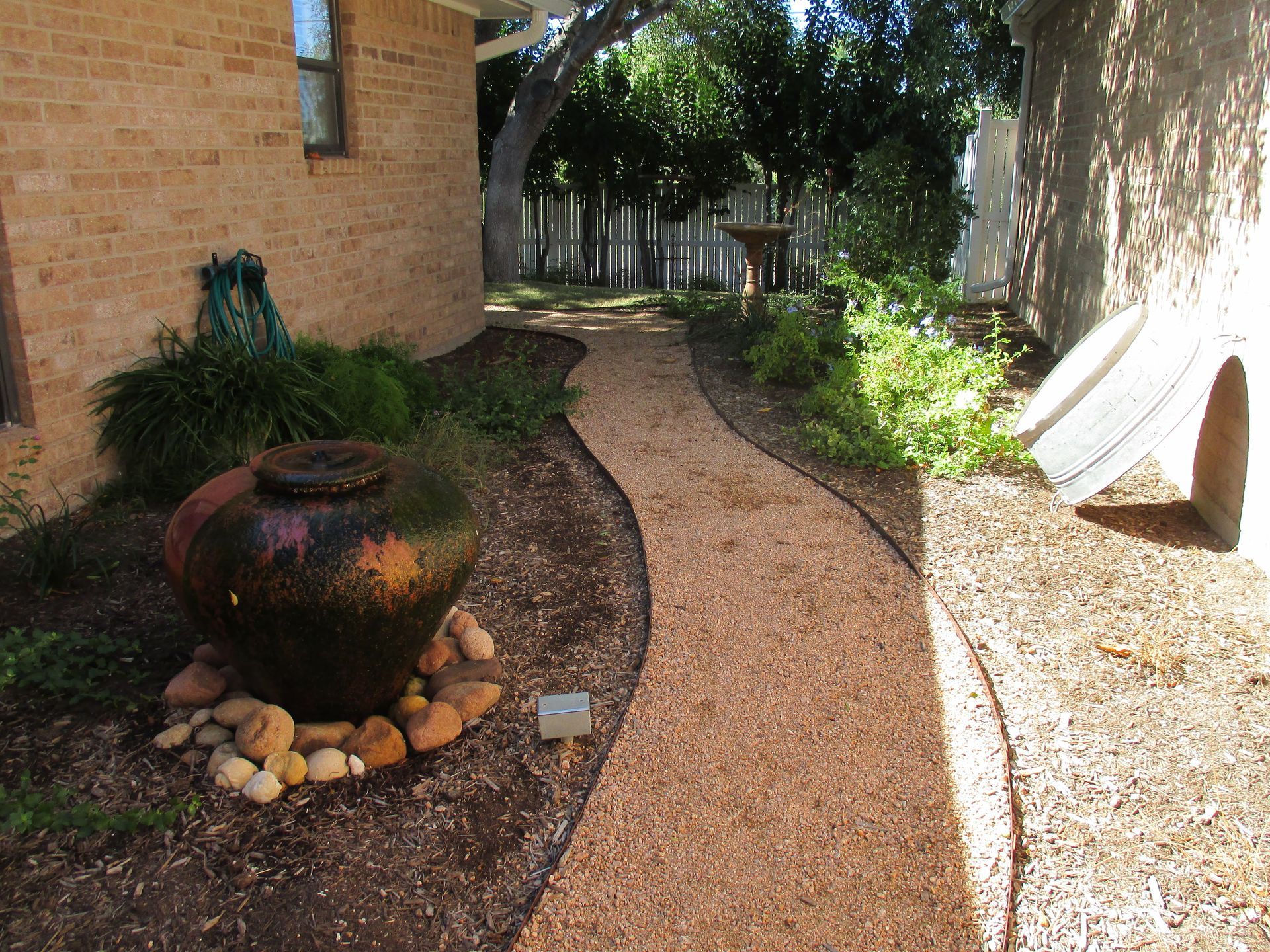 A brick house with a walkway leading to it