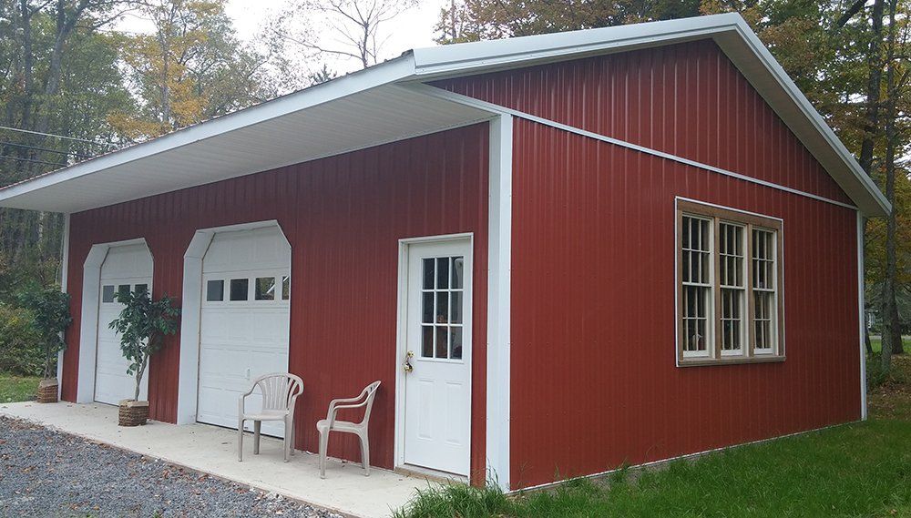 A red barn with white trim and a window