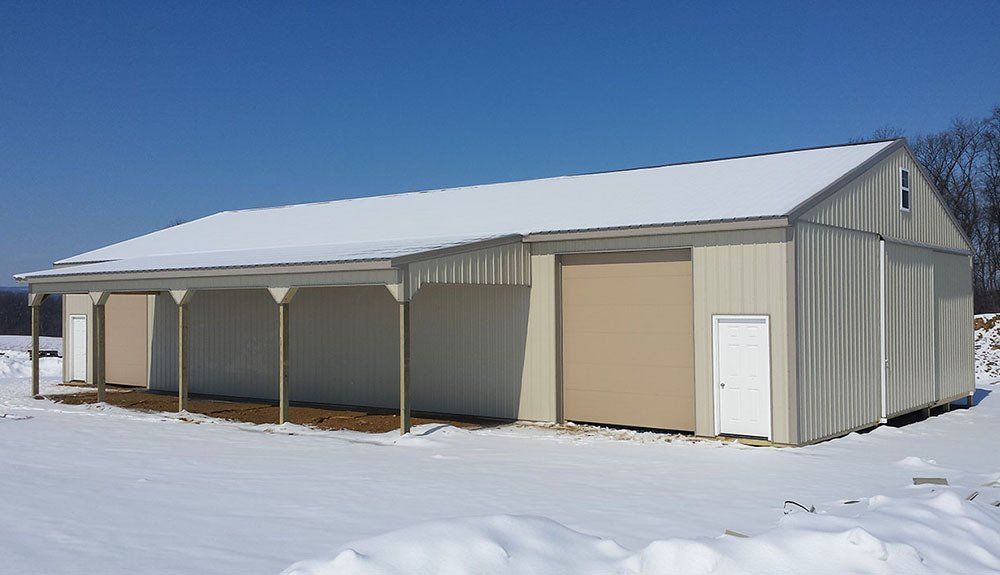 A large building in the middle of a snowy field