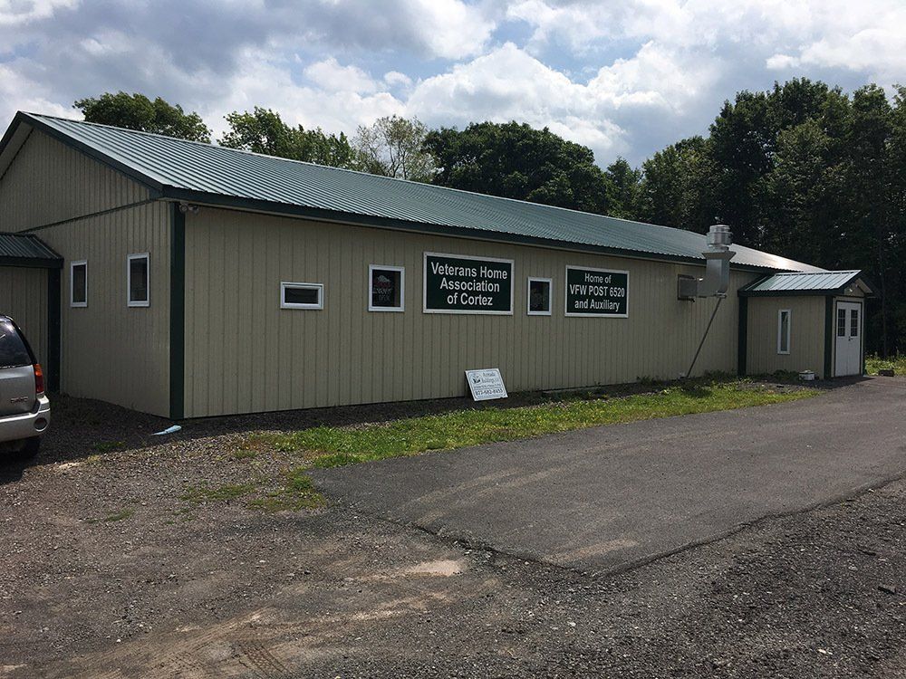 A large building with a green roof.