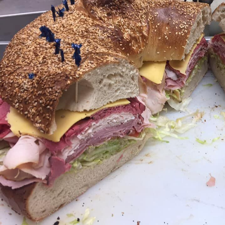 A Sandwich With A Bunch Of Meat And Cheese On It - Mahopac, NY - Our Town Bagels & Bakery