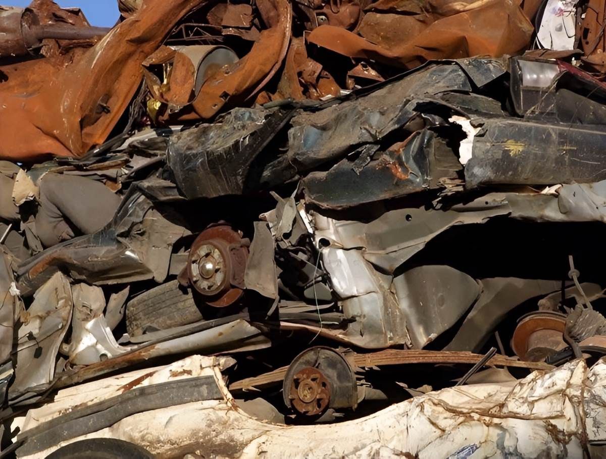 A Pile of Scrap Metal is Stacked on Top of Each Other — Anderson Waste Services in Bowral, NSW