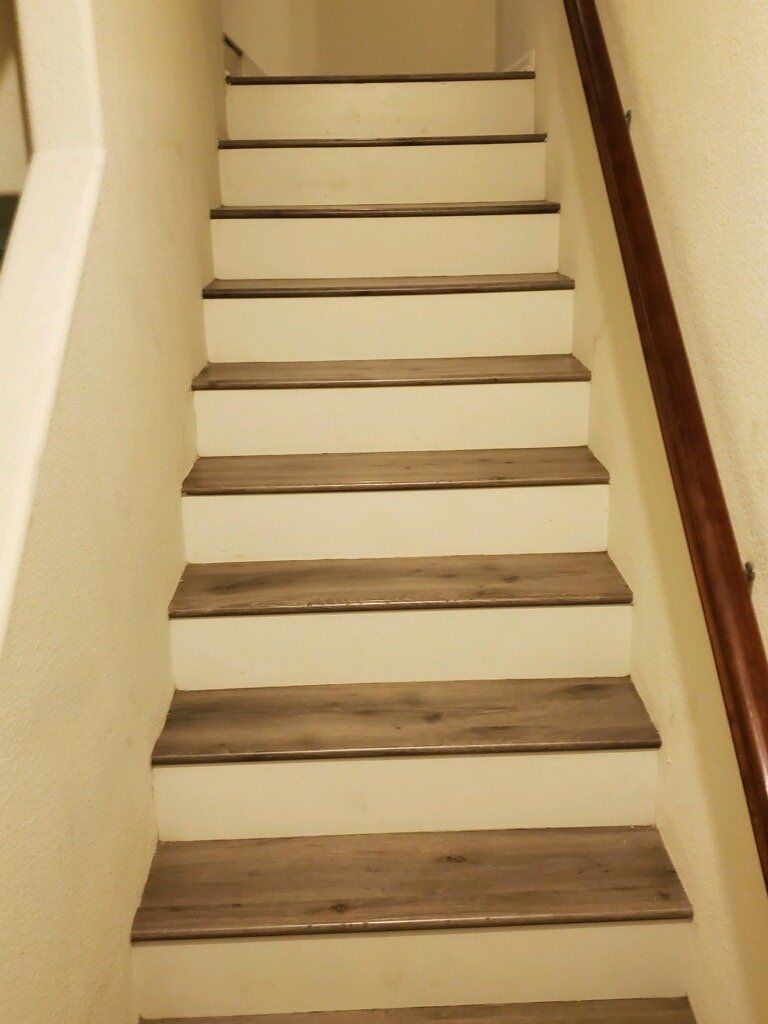 staircase with flush stairnose and white risers using laminate flooring installation otay mesa