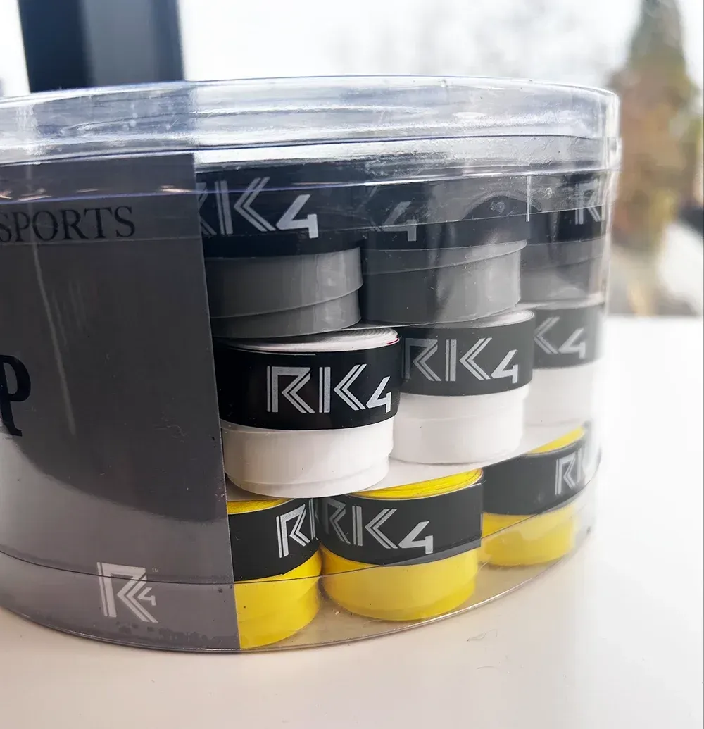 Clear plastic container filled with gray abrasive discs.