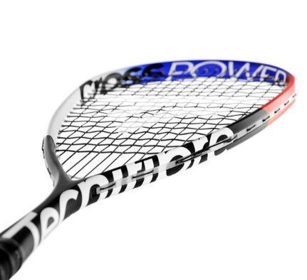 A close up of a badminton racket with orange strings