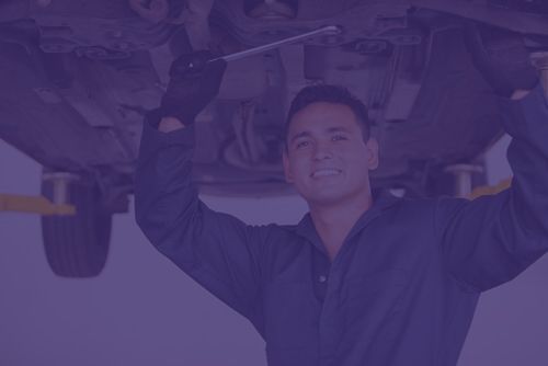 Auto Mechanic working the suspension of the car — Mechanic in Cairns QLD