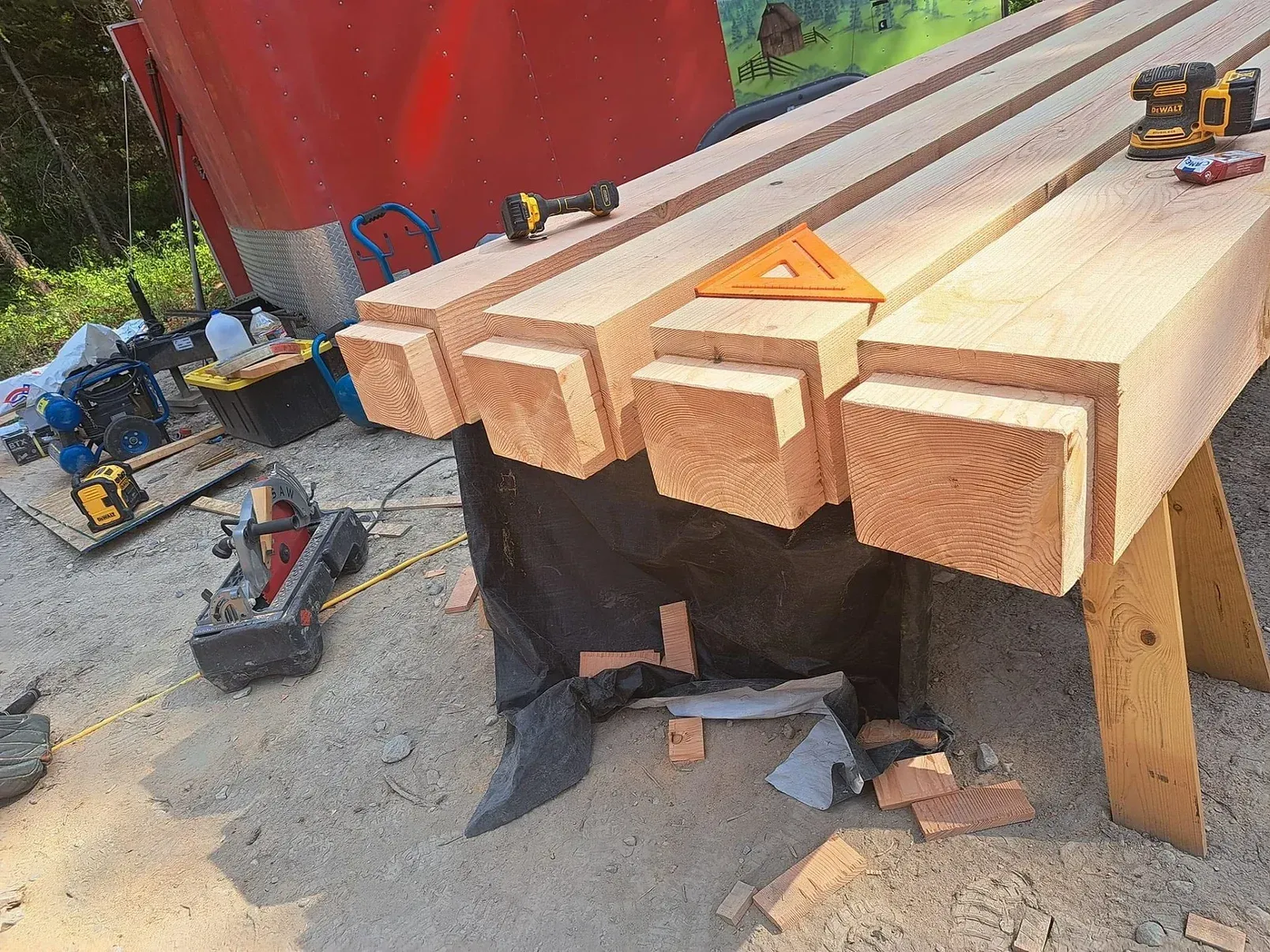 A stack of wooden beams sitting on top of a wooden table.