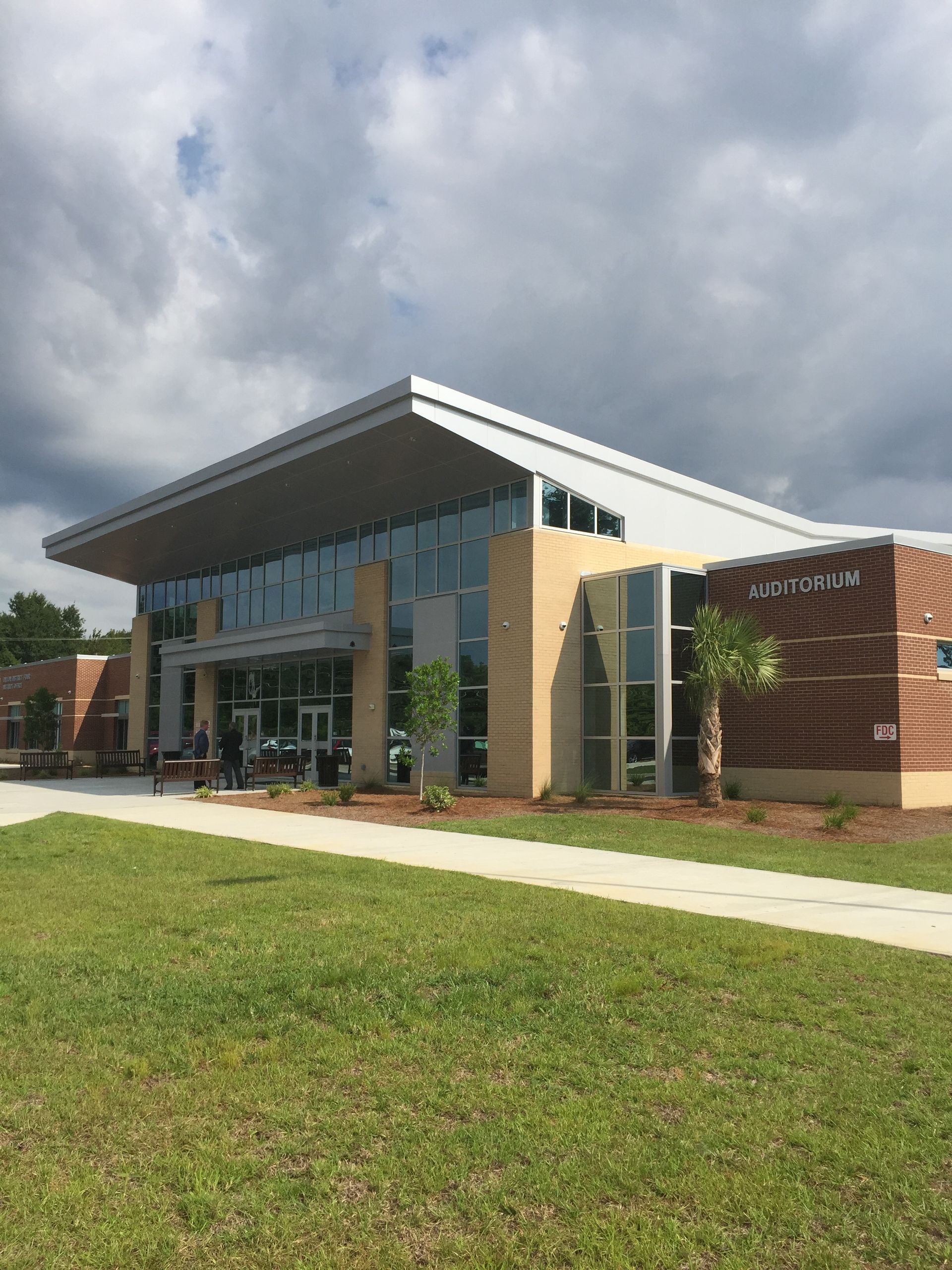 photo of auditorium with glass front facade 