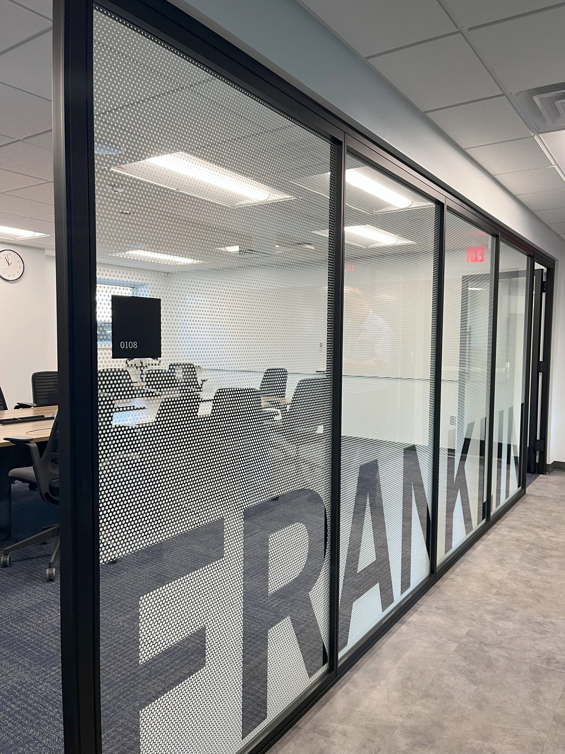 stained glass of a conference room with the work FRANKLIN 