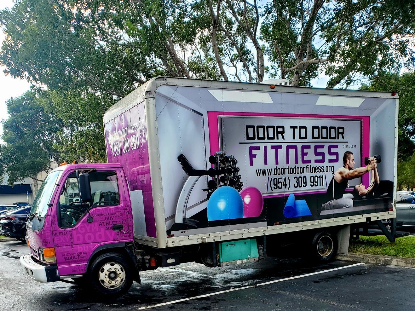 A purple door to door fitness truck - fitness at your doorstep in South Florida.