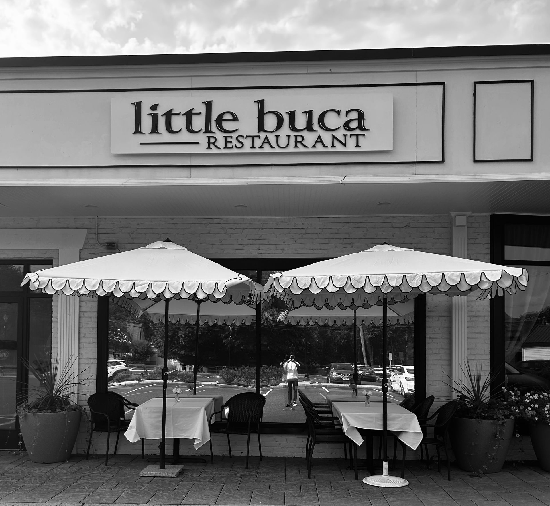 A black and white photo of the little buca restaurant