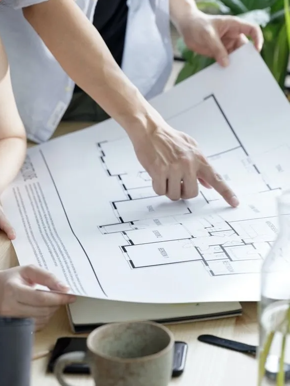 Engineers reviewing development plans