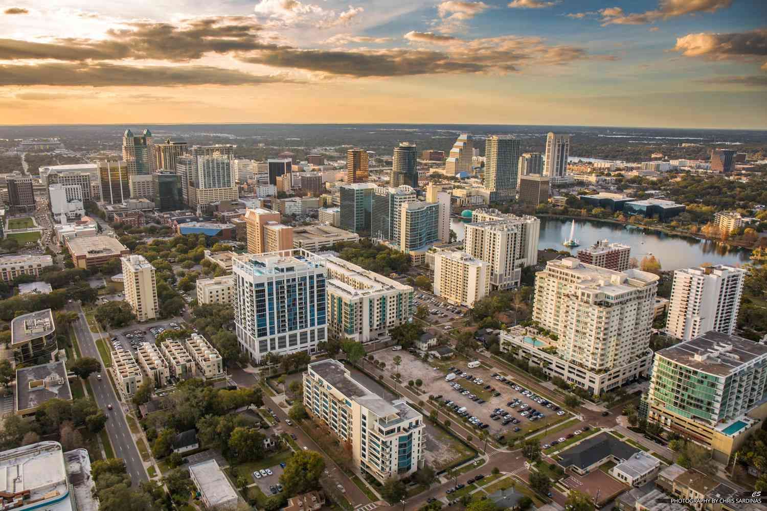 An aerial view of a city with lots of buildings and trees.