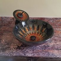 A sink is sitting on top of a granite counter.