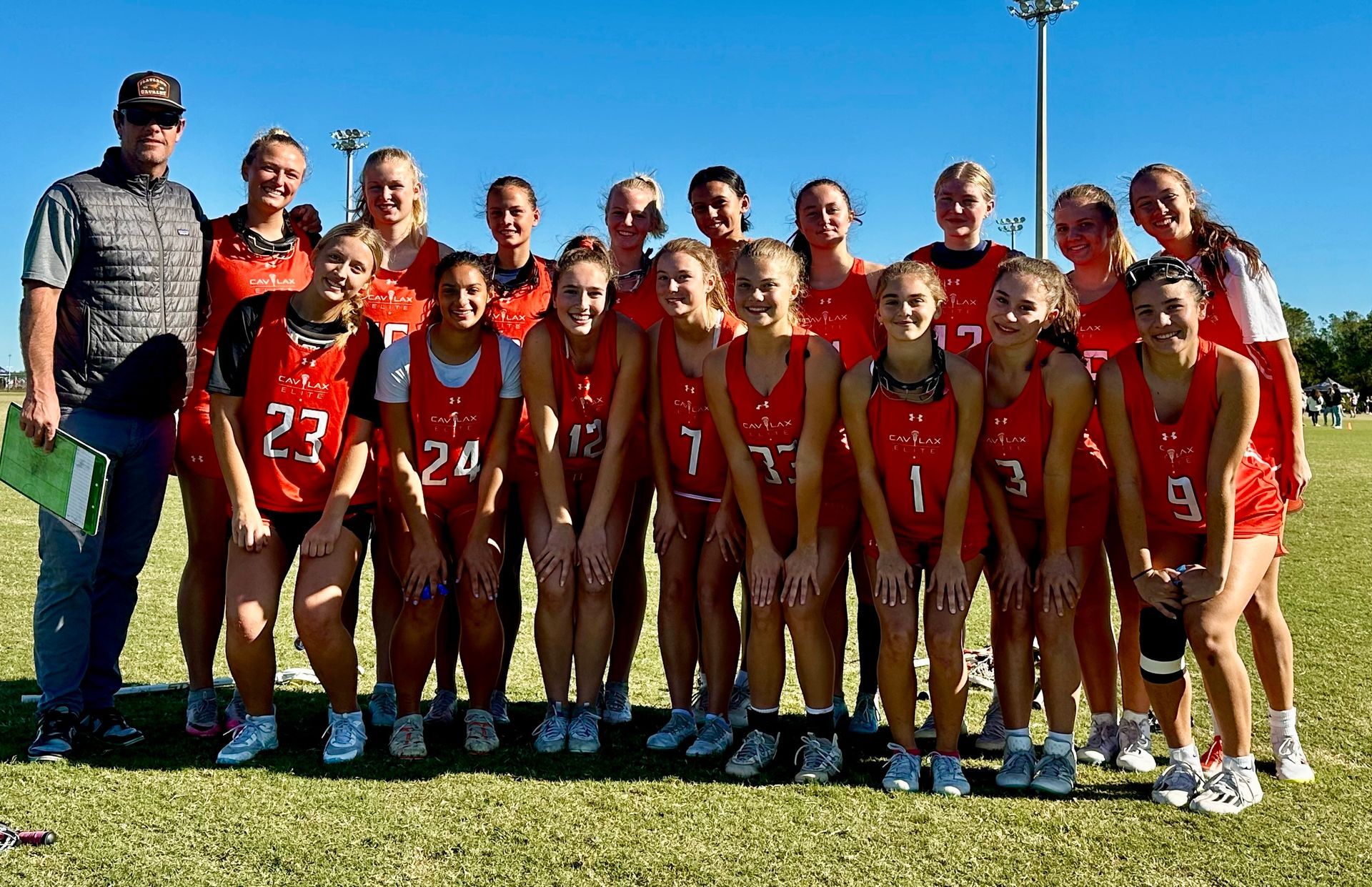 CAV Lax Elite 2026 girls lacrosse team group photo in red uniforms