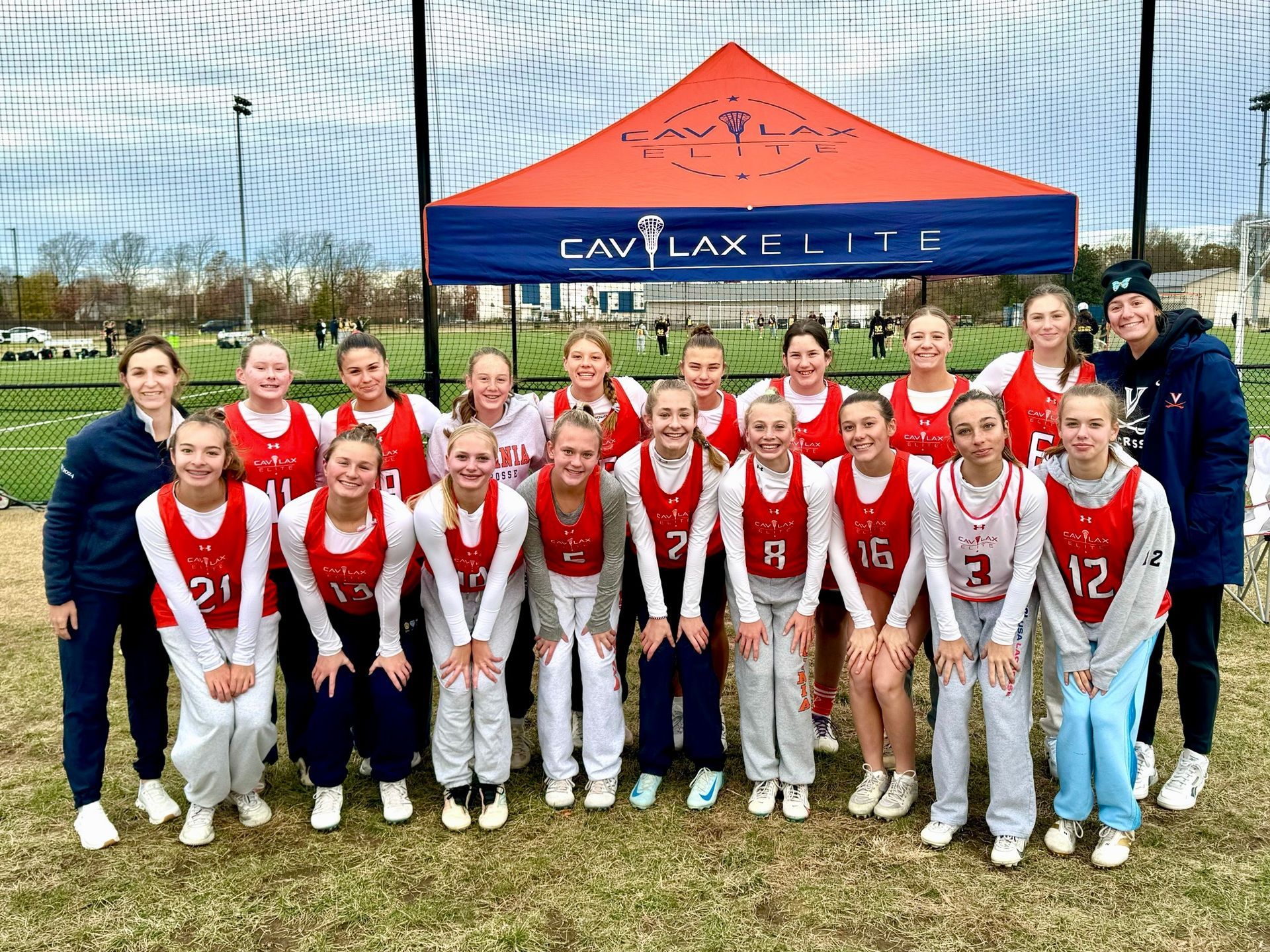 CAV Lax Elite 2028 team photo featuring players in red and white uniforms on field