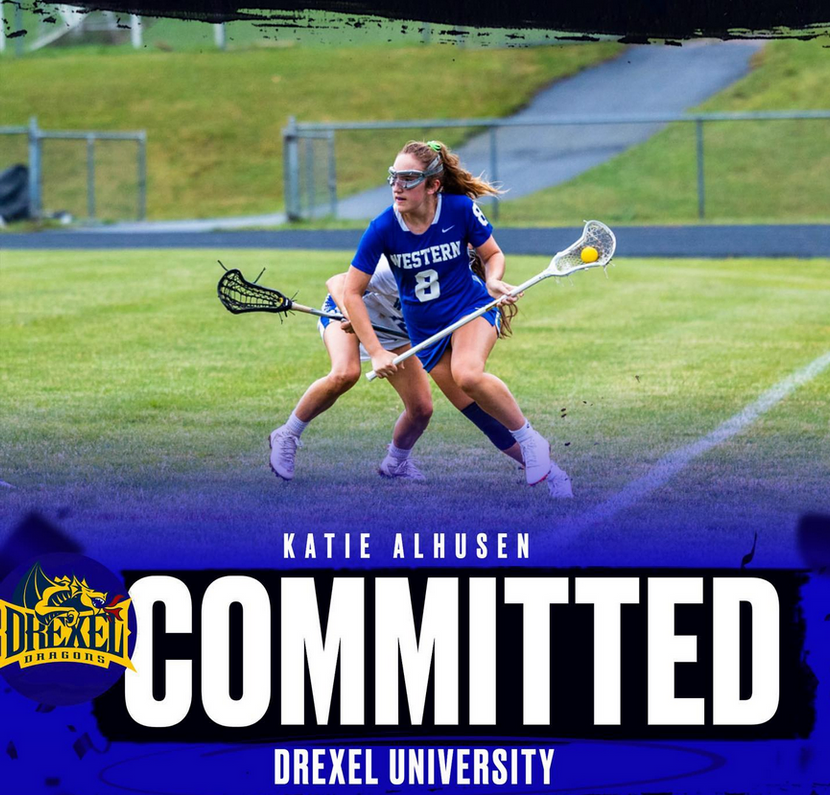 Katie Alhusen commits wearing blue jersey #8 on turf field
