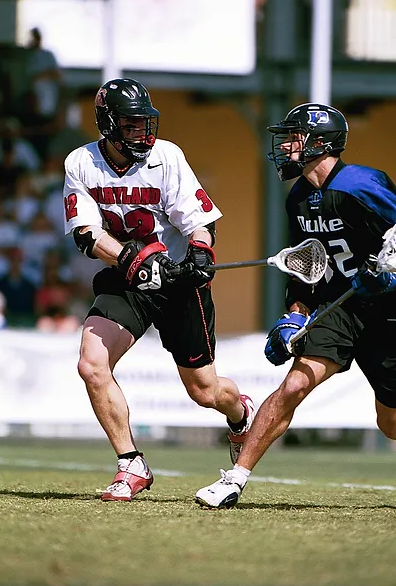 Picture of Coach Carrington King playing defense in college at University of Maryland