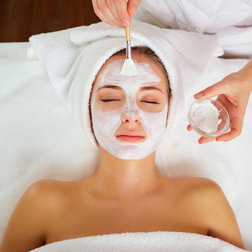 Applying Facial Cream — Greenwood, SC — Merle Norman Cosmetic Studio