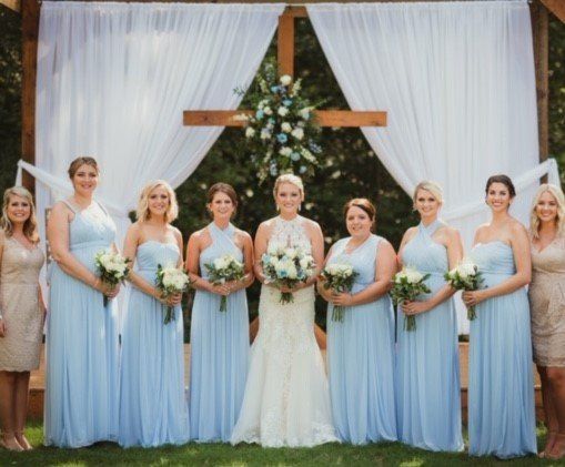 Women Holding Flowers — Greenwood, SC — Merle Norman Cosmetic Studio