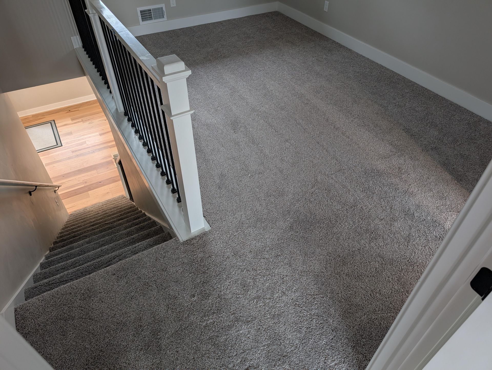 There is a staircase leading up to the second floor of a house.