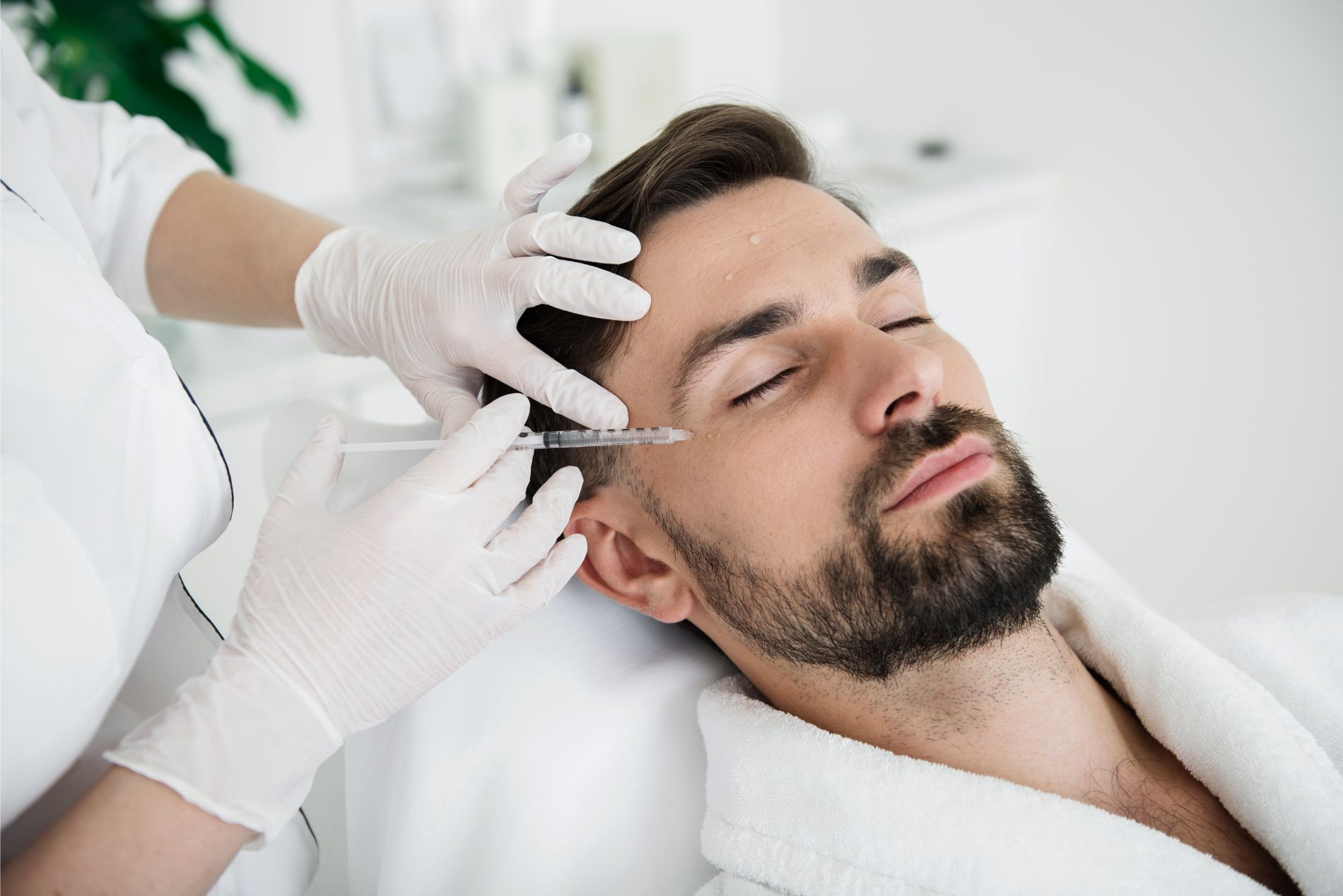 Man receiving cosmetic procedure