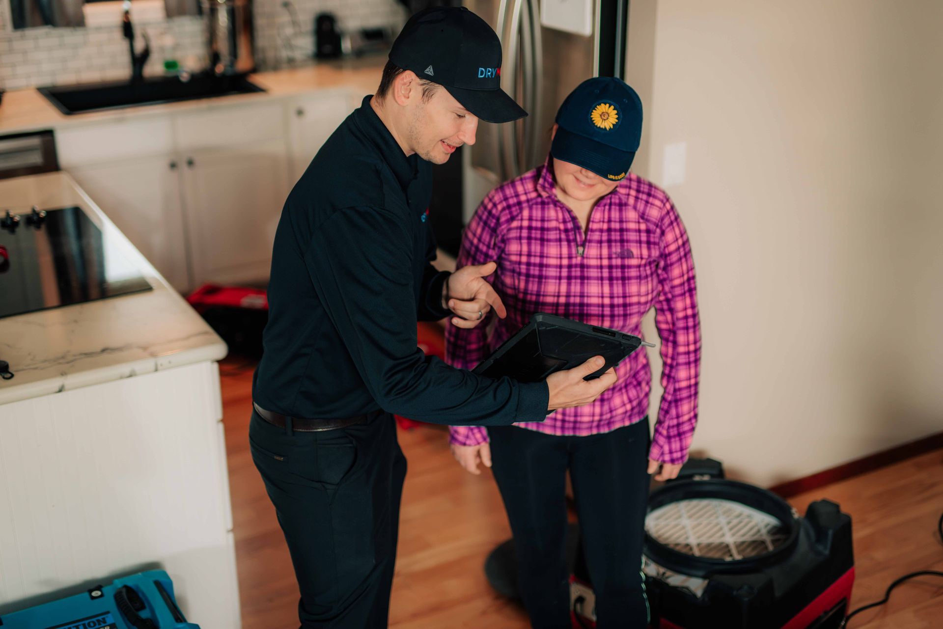 DryMax technician goes over a full restoration plan for a customers home.
