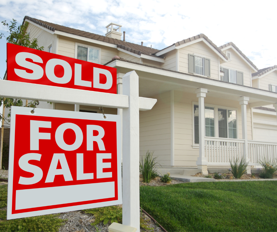 A residential home features a prominent red and white 