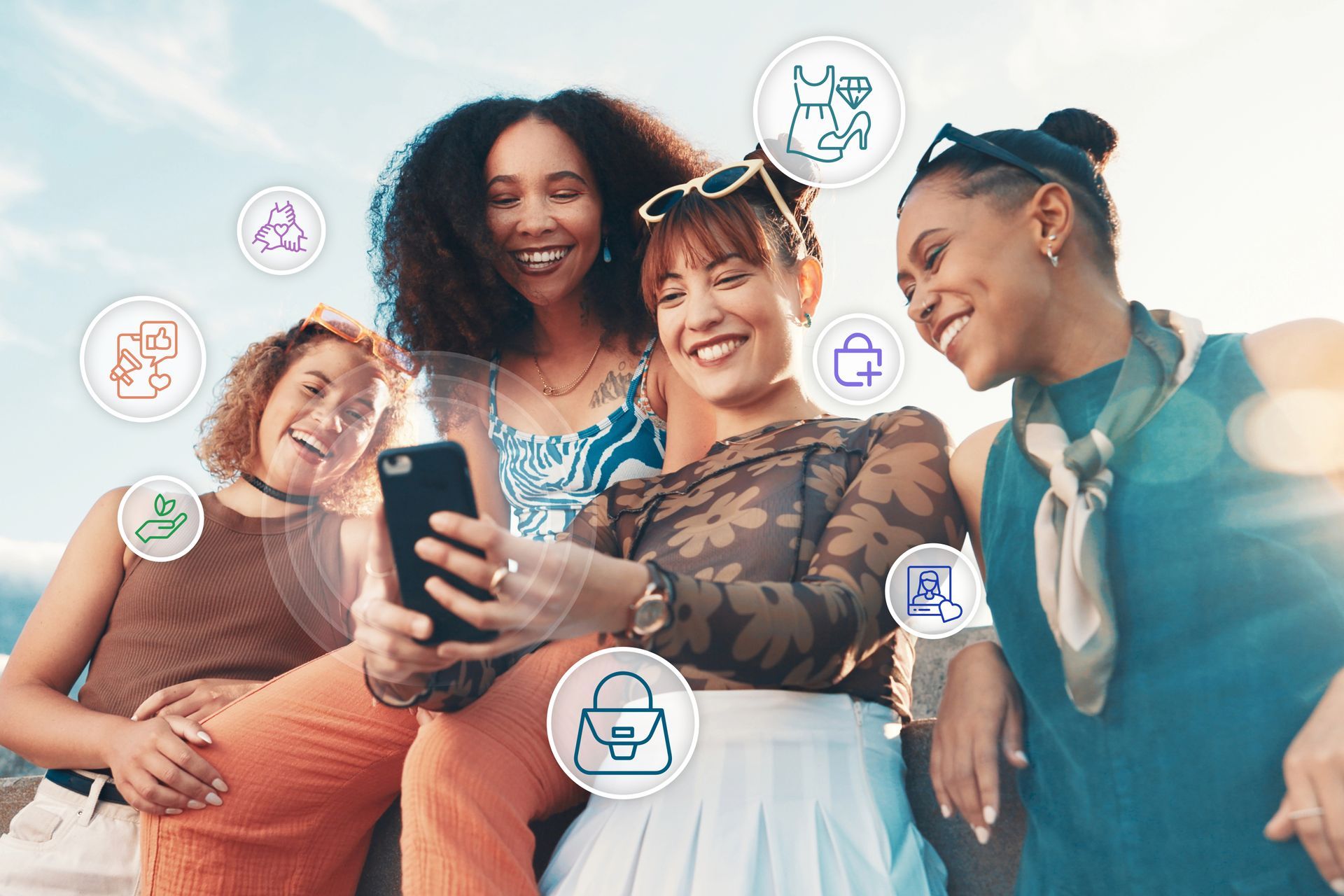 Four diverse women smile, looking at a phone, icons of services hover, outdoor setting, sunny.