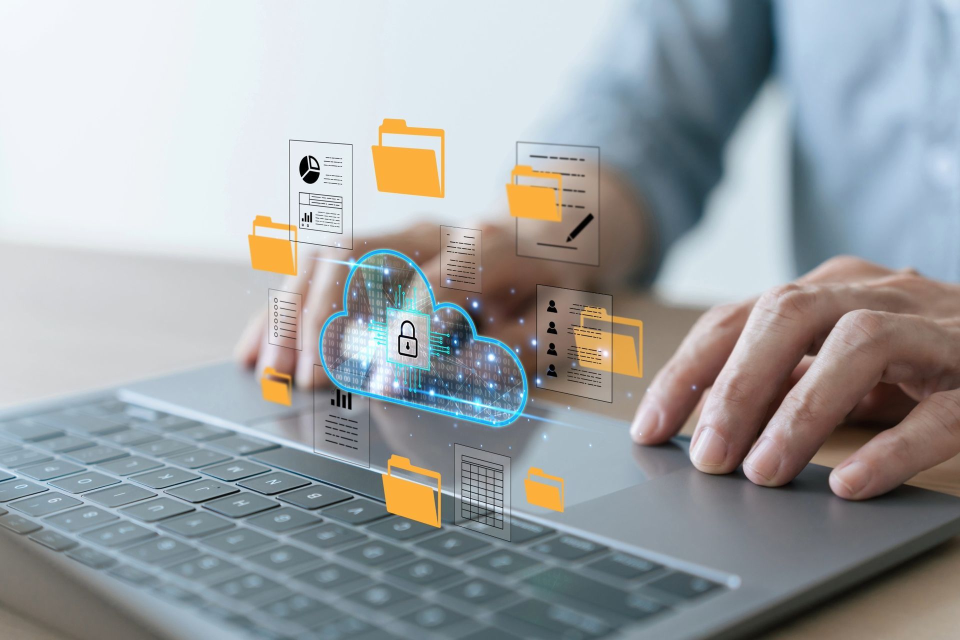 Hands using laptop, cloud data storage concept with folders, lock icon.