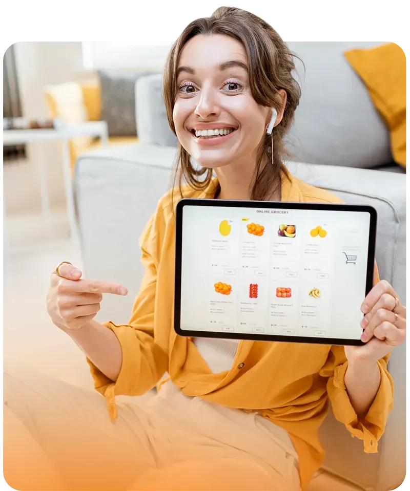 woman pointing to tablet with ecommerce store open