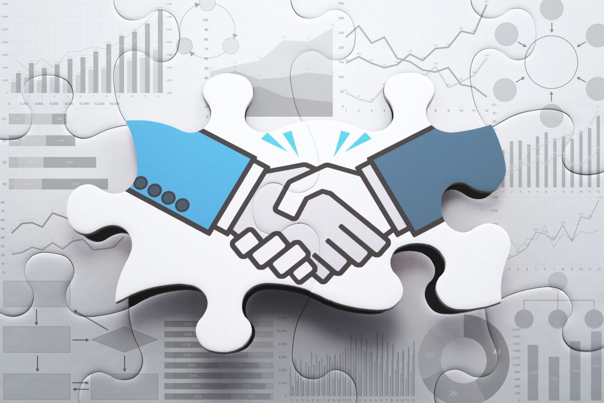 Handshake graphic on a puzzle piece; white, gray, and blue. Business or collaboration theme.