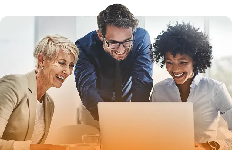 three professionals looking at laptop