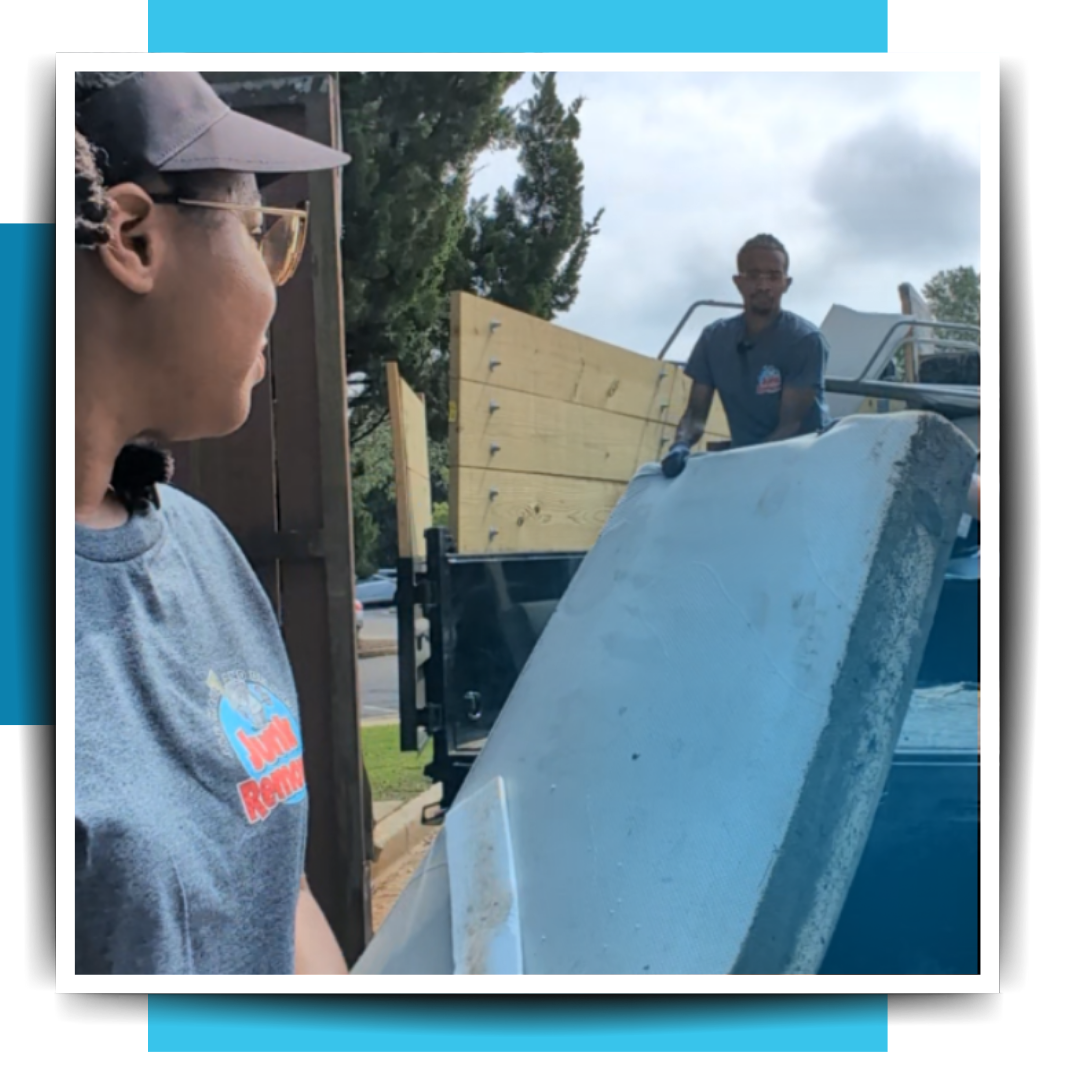 Two persons getting the trash in the trailer truck