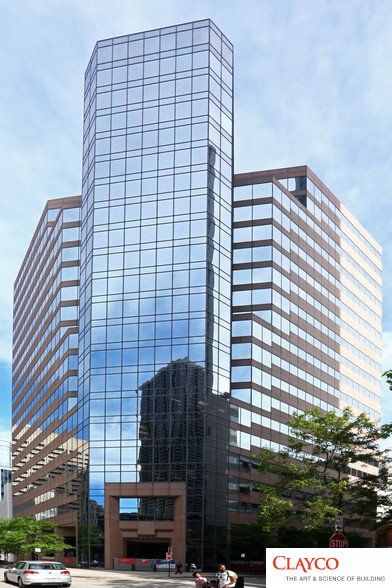 A clayco building with a lot of windows