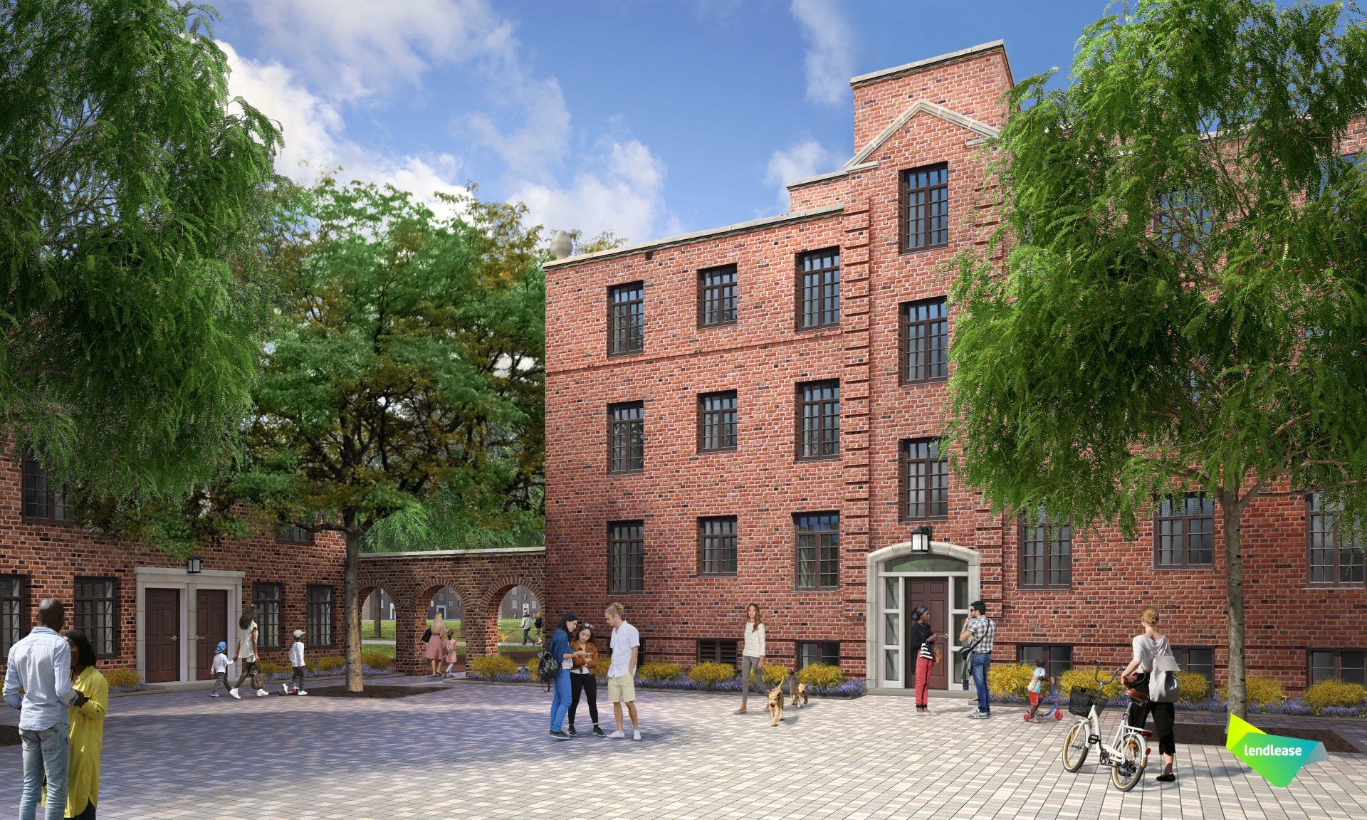 A group of people are standing in front of a large brick building.