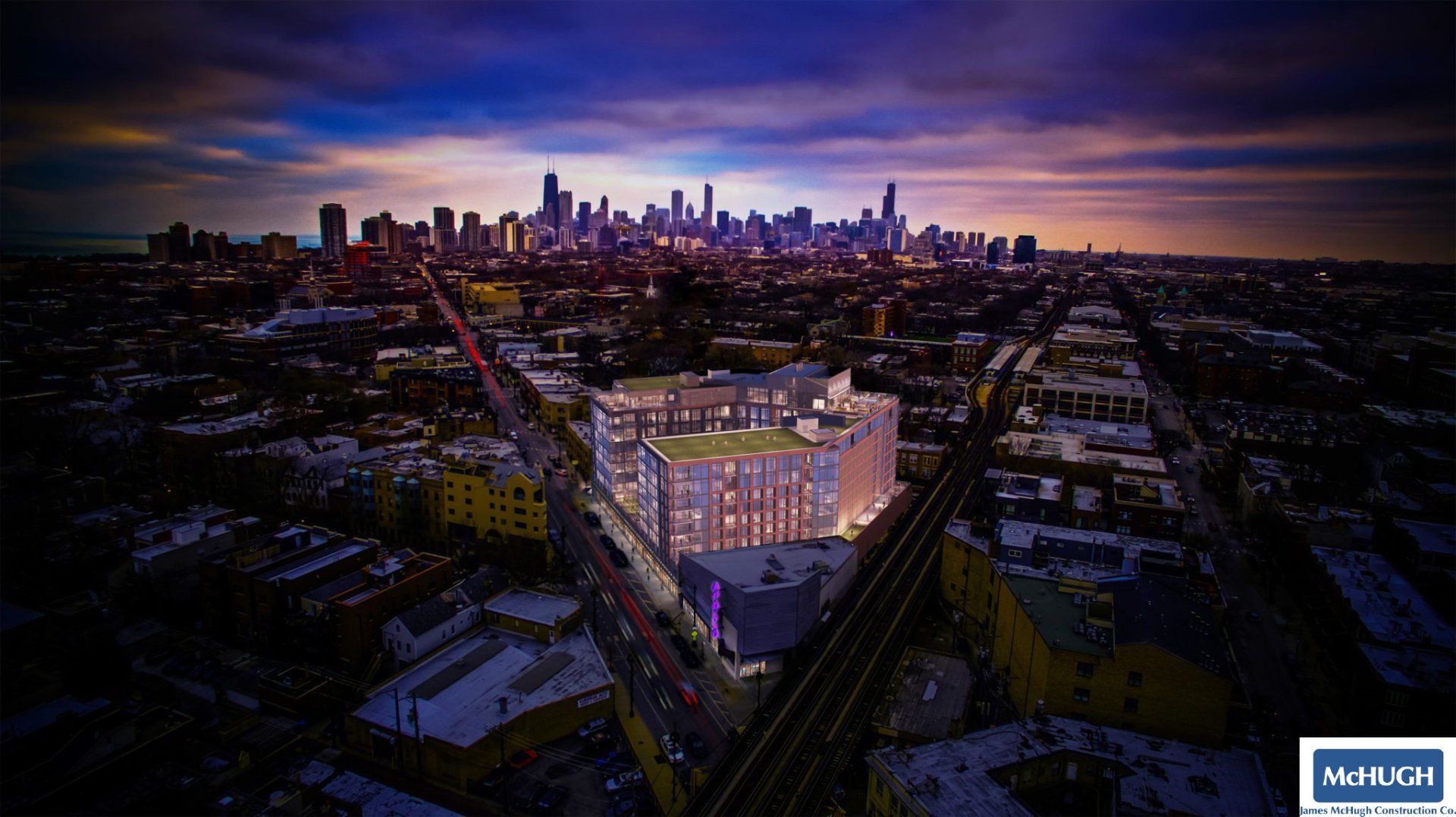 An aerial view of a city at night with a large building in the foreground.