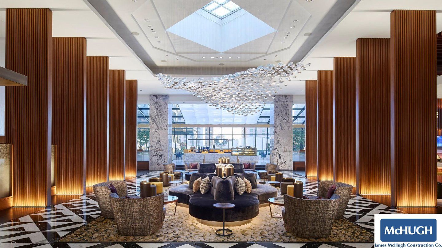 A large lobby with a sign that says mchugh on it