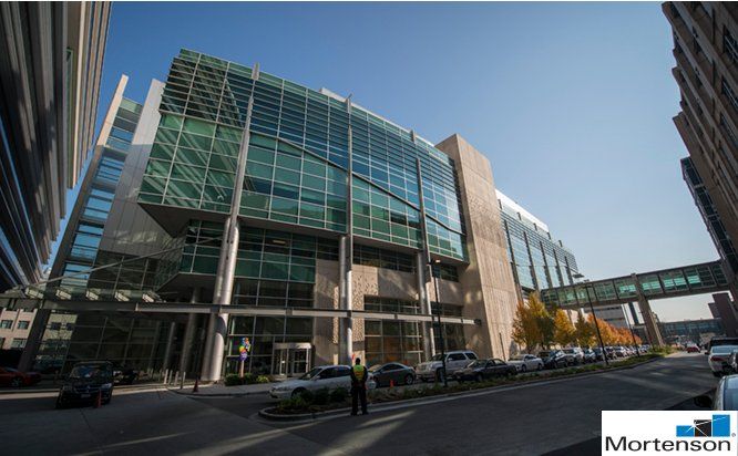 A large building with a mortenson logo on it