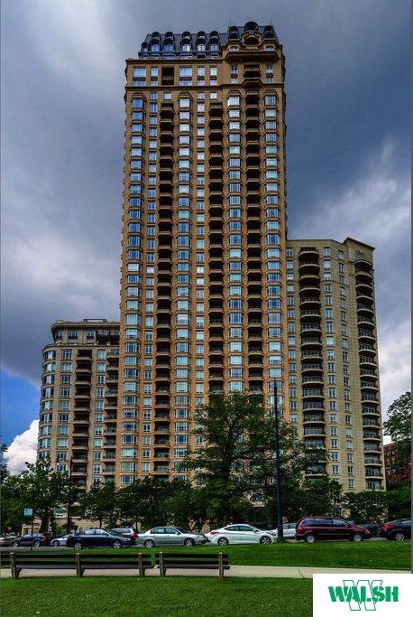 A tall building with the word walsh on the bottom