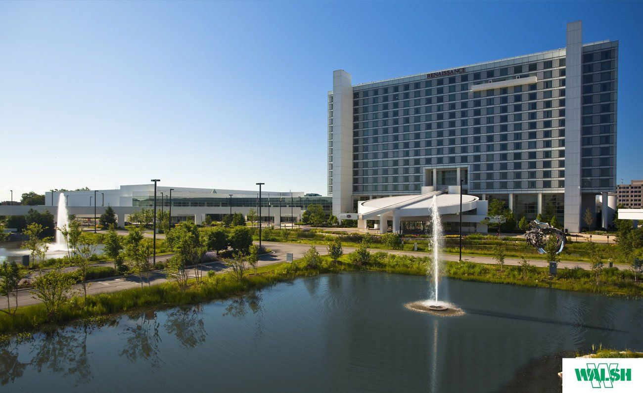 A large building with a fountain in front of it
