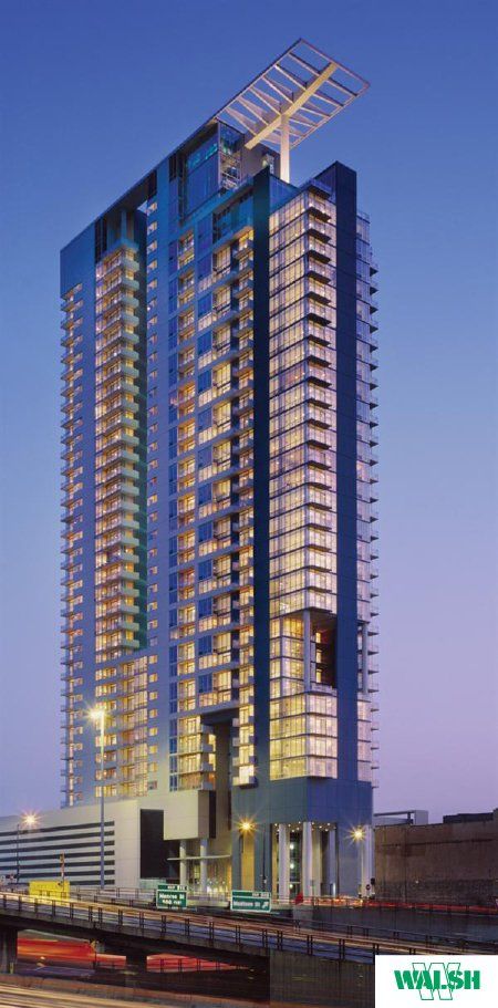 A tall building with the word vollsh on it