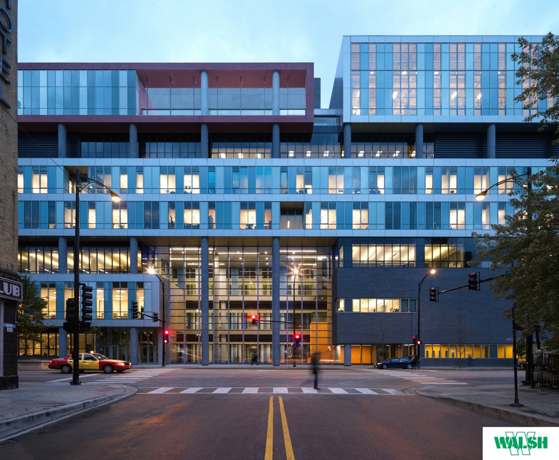 A large building with the word walsh on the bottom right