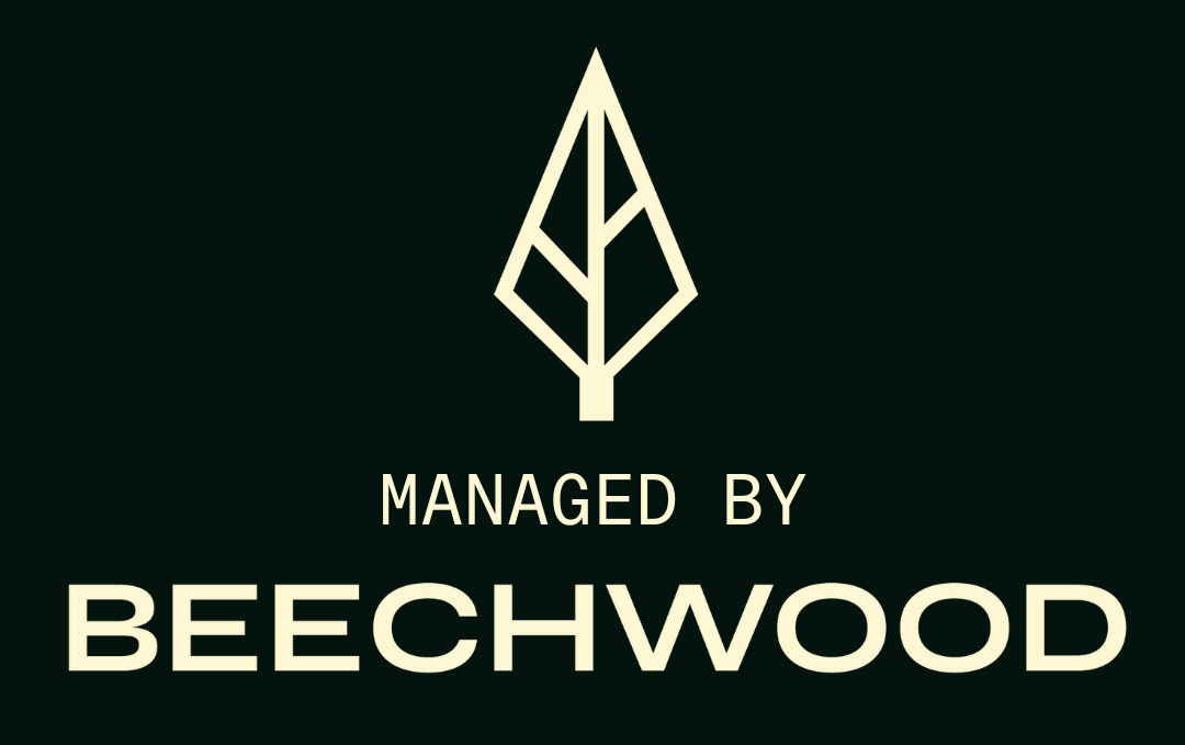 A logo for beechwood shows a tree with a leaf on it.