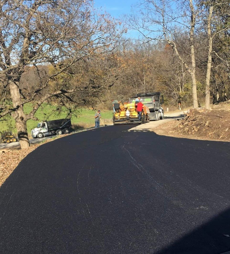 A road with a lot of trees on the side of it