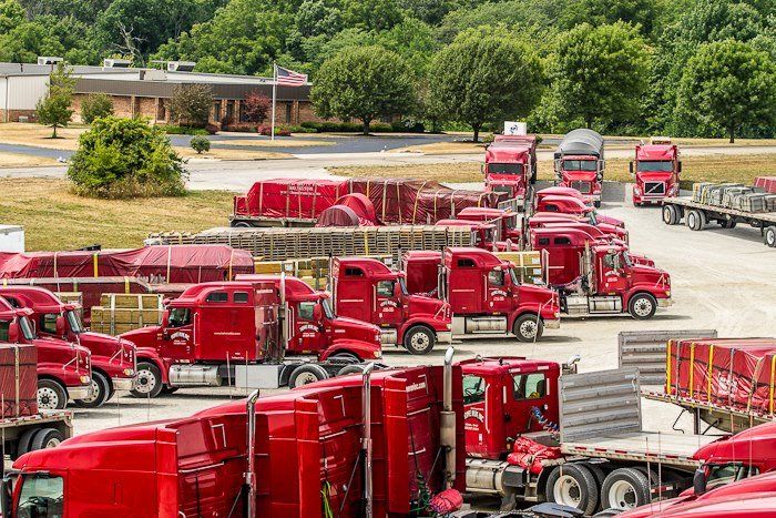 Red semis parked in lot