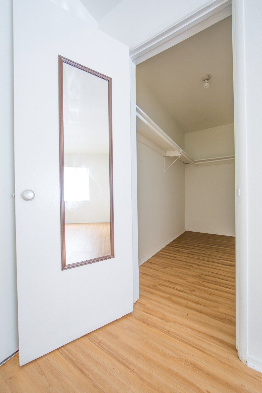 walk in closet with mirror
