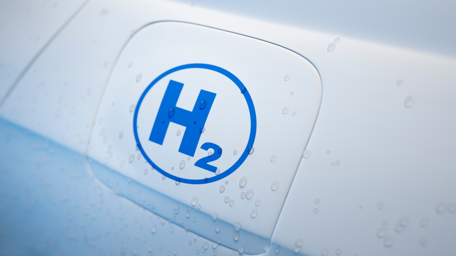 Blue hydrogen fuel symbol on a white vehicle door.